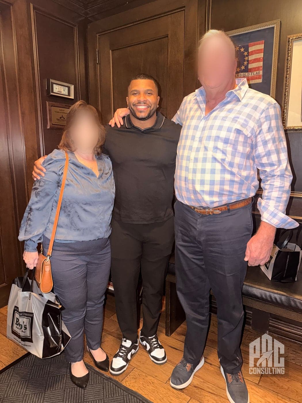 Phillip Crawford with two business owners he has worked with — their faces blurred for confidentiality